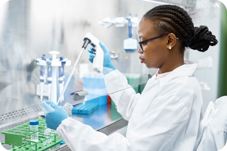 Photo of scientist pipetting into a tube