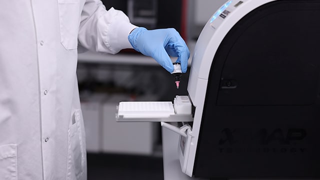 Scientist using MAGPIX Instrument in lab